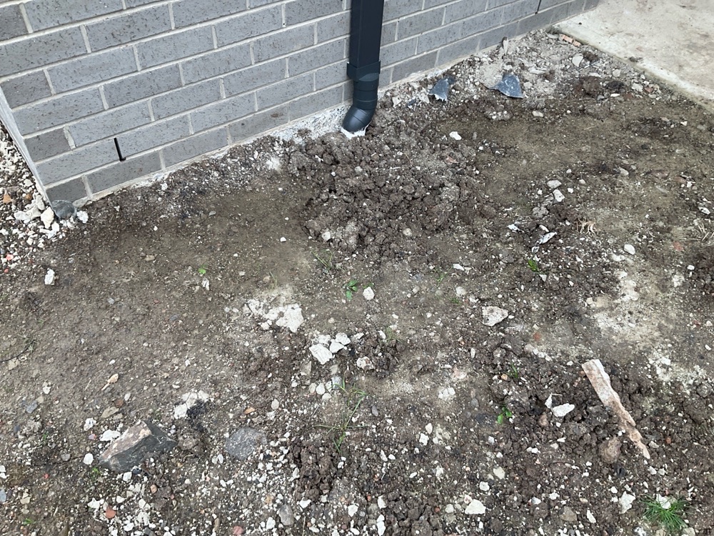 Site grading incomplete at practical completion, recorded during a pre-handover inspection in Donnybrook