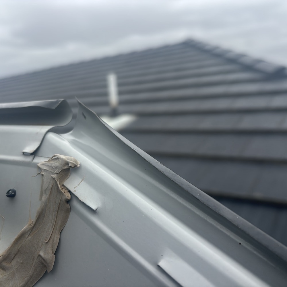 Sections of the gutter system not installed correctly, recorded during a pre-purchase inspection in Donnybrook