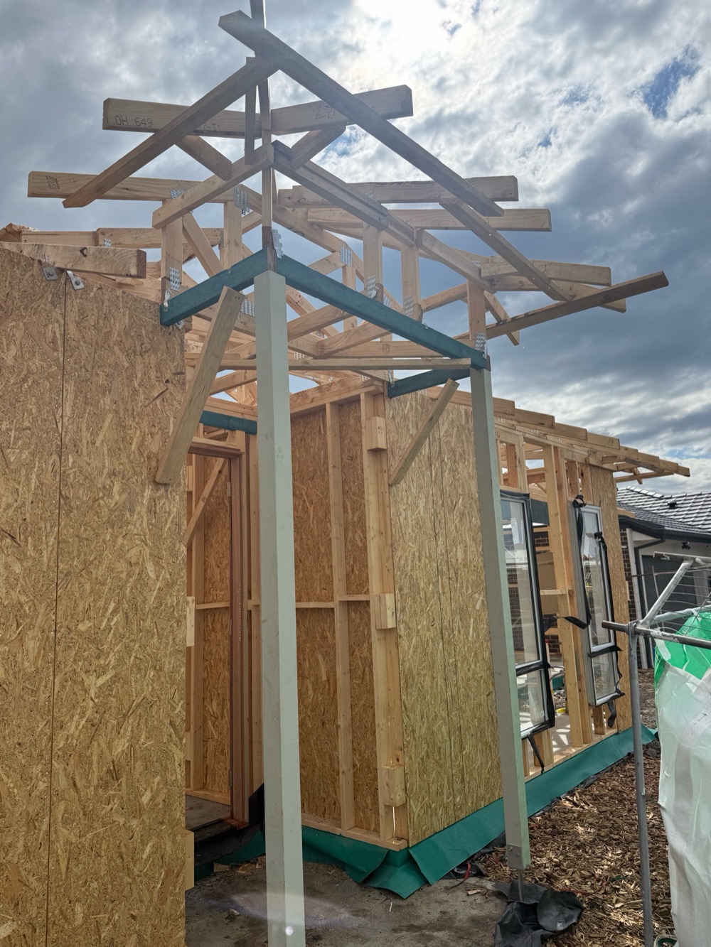 Porch post tie-down inadequate for the load it carries, recorded during a frame inspection in Donnybrook