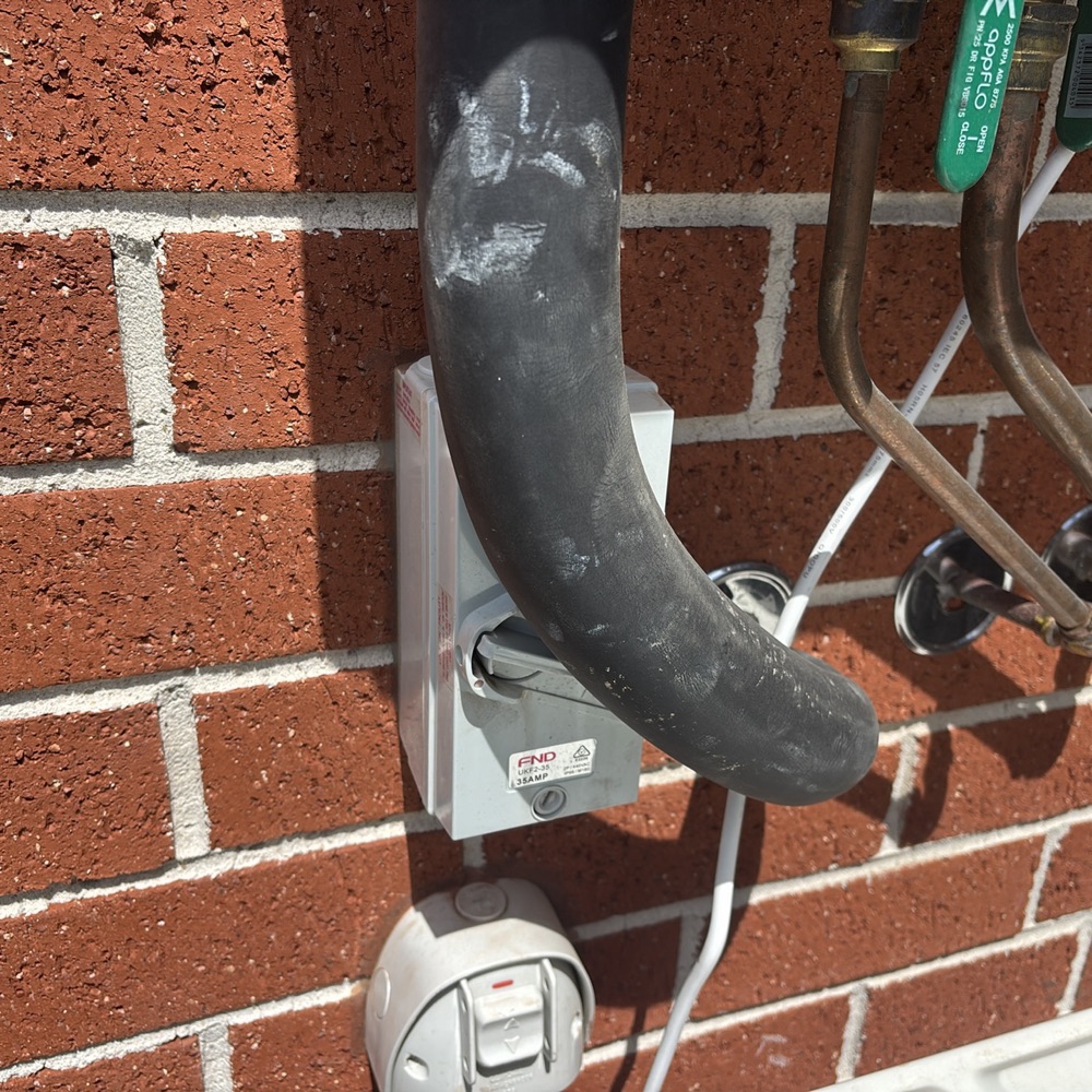 Heating and cooling isolator not readily accessible, recorded during a building and pest inspection in Donnybrook